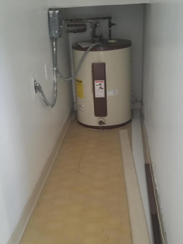 utility room with electric water heater