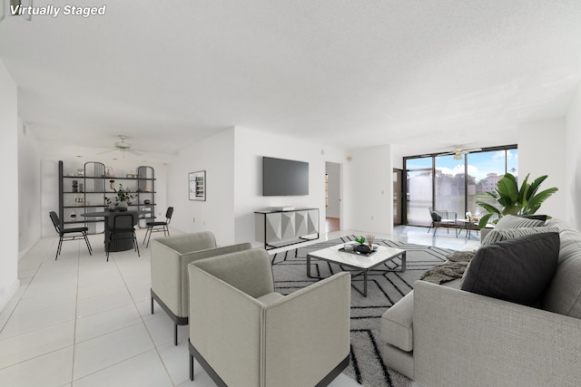 living room featuring ceiling fan and light tile patterned floors