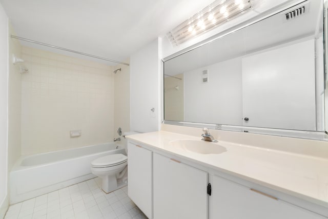 full bathroom with vanity, toilet, tile patterned flooring, and tiled shower / bath