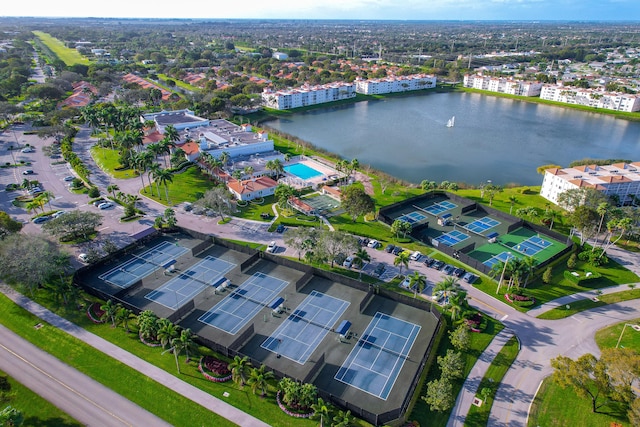 birds eye view of property with a water view