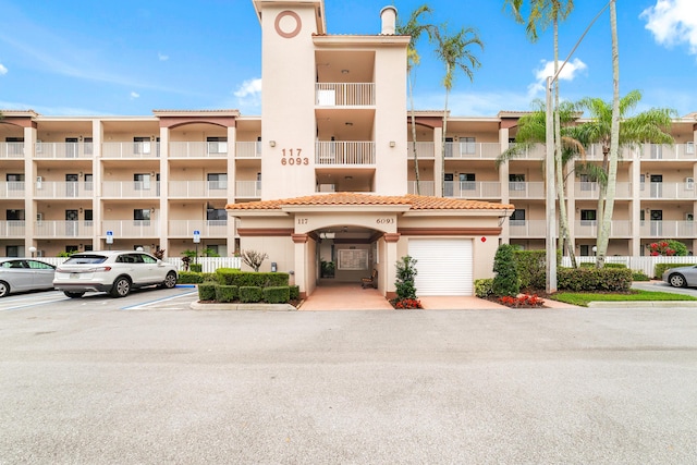 6093 Pointe Regal Cir Unit 106, Delray Beach, FL 33484 - view of apartment building / complex featuring uncovered parking