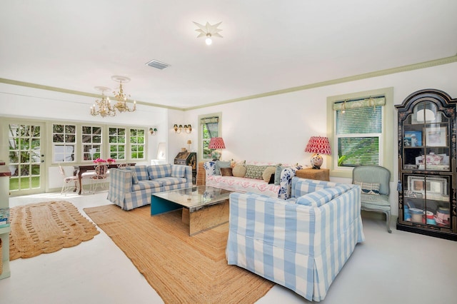 living room with ornamental molding and a notable chandelier