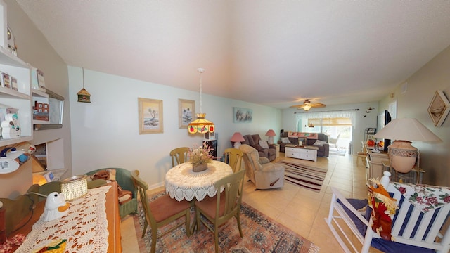 dining area featuring light tile patterned flooring and ceiling fan