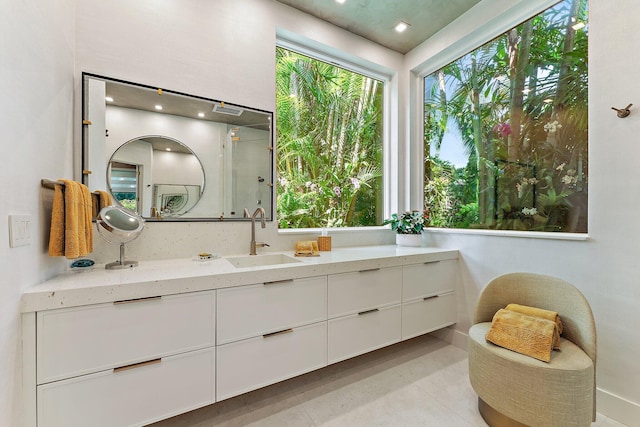 bathroom with tile patterned flooring, vanity, and an enclosed shower