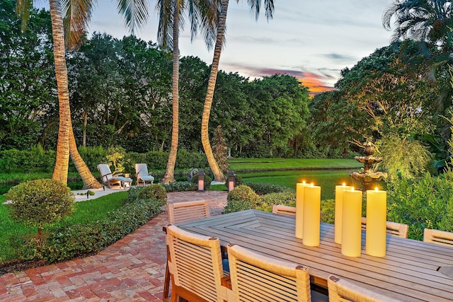 view of patio terrace at dusk