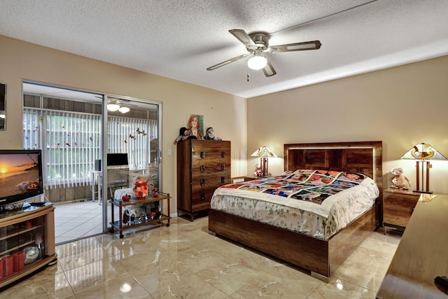 bedroom with access to outside, ceiling fan, and a textured ceiling