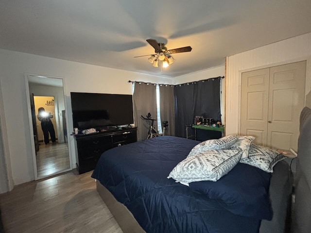 bedroom featuring a closet, ceiling fan, and wood-type flooring