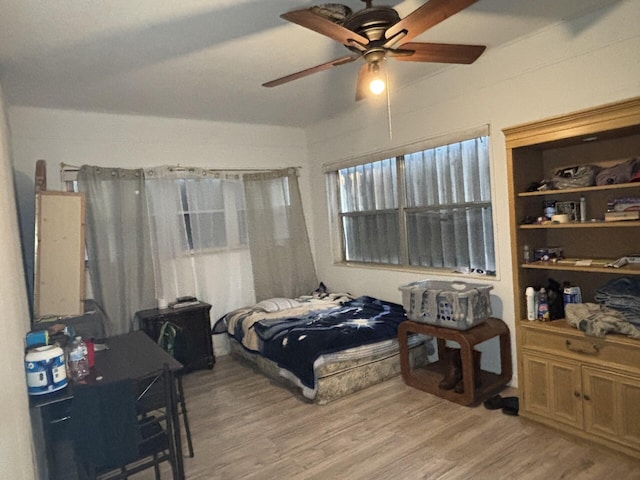 bedroom featuring ceiling fan and light hardwood / wood-style flooring