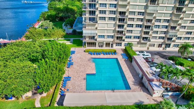 view of swimming pool with a water view