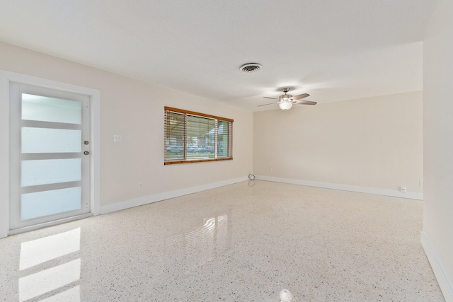 unfurnished room with ceiling fan