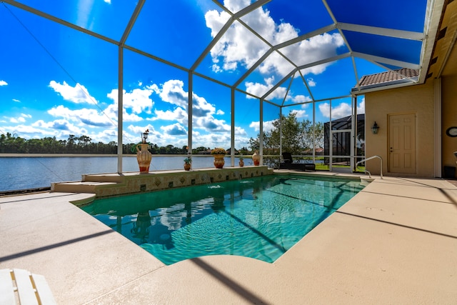 view of pool featuring a patio area, a lanai, and a water view