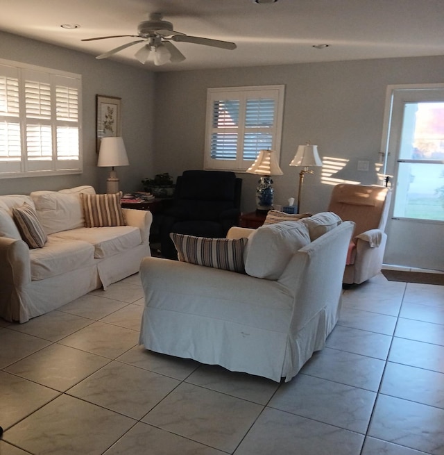 living room with ceiling fan and light tile patterned floors