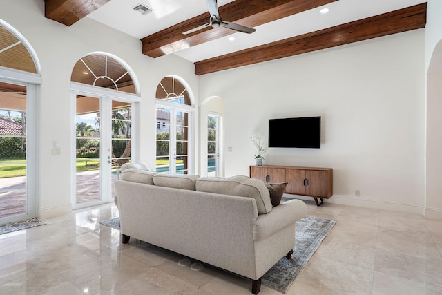 living room with ceiling fan, french doors, and beamed ceiling