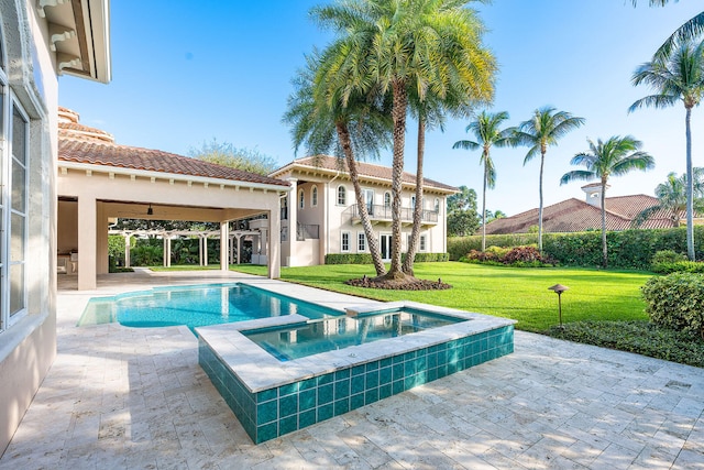 view of swimming pool featuring a lawn, ceiling fan, an in ground hot tub, and a patio