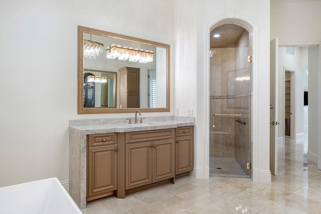 bathroom featuring plus walk in shower and vanity