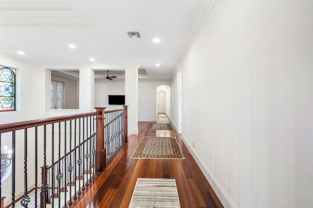 hallway featuring crown molding and dark hardwood / wood-style flooring