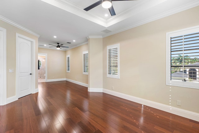 spare room with crown molding, dark hardwood / wood-style flooring, and ceiling fan