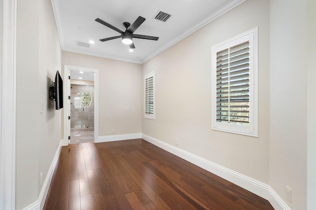 spare room featuring ceiling fan, dark hardwood / wood-style flooring, and ornamental molding