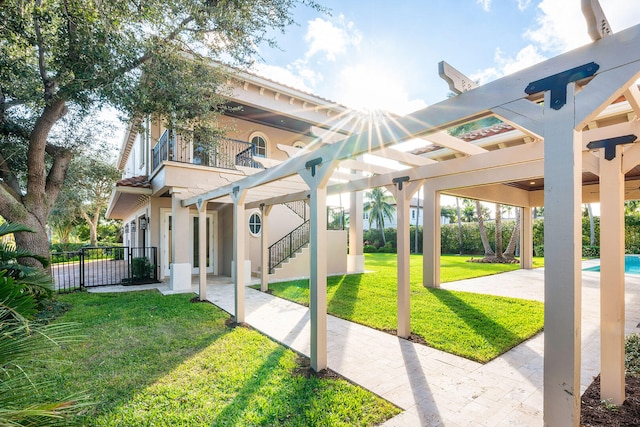 view of property's community with a patio area and a yard