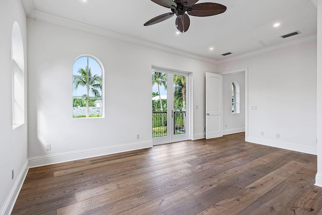 unfurnished room featuring ceiling fan, crown molding, and dark hardwood / wood-style floors