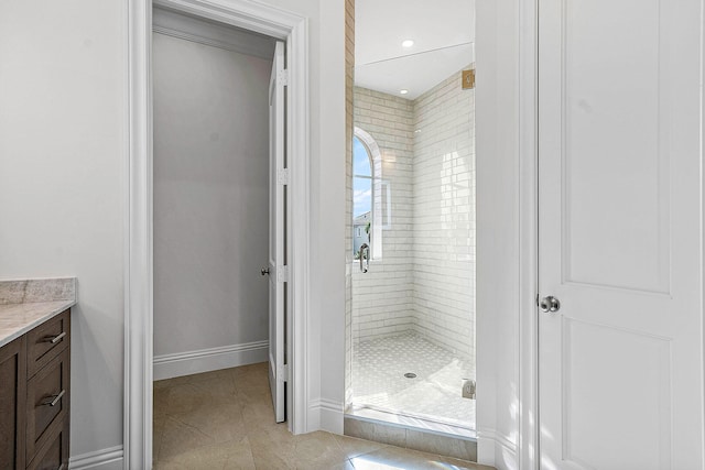 bathroom with vanity and an enclosed shower