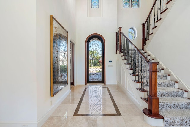 entryway with a high ceiling