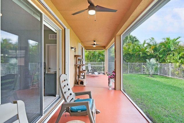 sunroom / solarium with ceiling fan