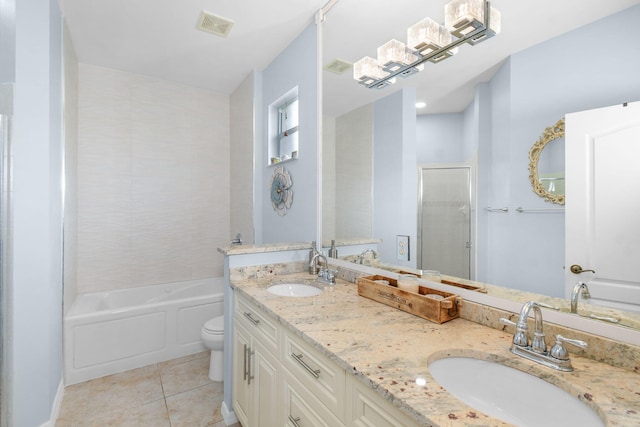 bathroom with vanity, toilet, and tile patterned flooring