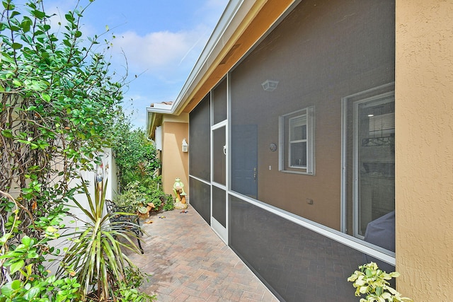 view of patio with a sunroom