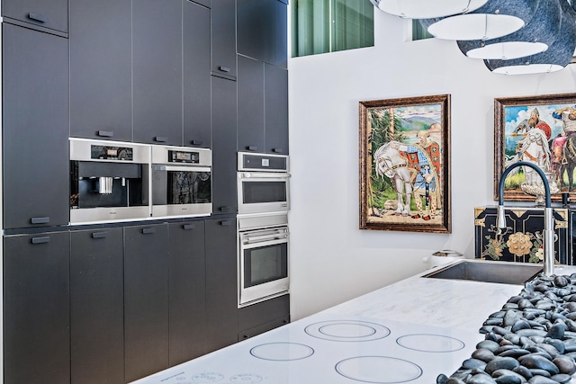 kitchen featuring sink and stainless steel double oven