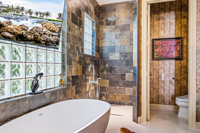 bathroom featuring tile patterned floors, plus walk in shower, and toilet