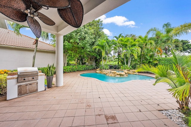 view of pool featuring a grill, a patio, and ceiling fan