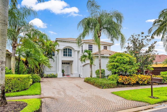 mediterranean / spanish-style house featuring a garage