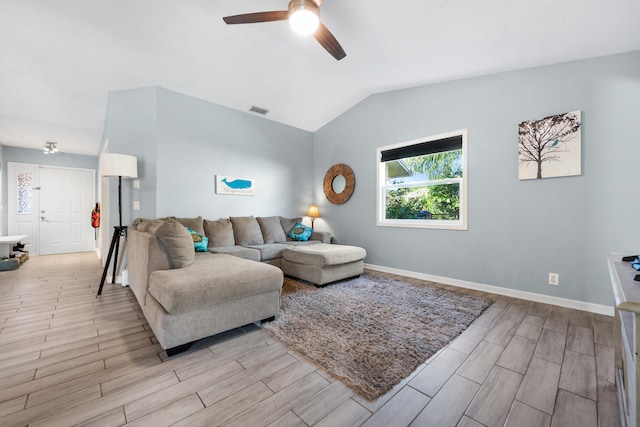 living room featuring light wood-type flooring, ceiling fan, and lofted ceiling