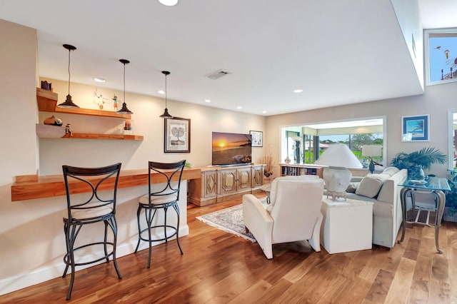 living room with light hardwood / wood-style floors