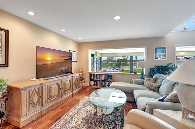 living room with light hardwood / wood-style flooring