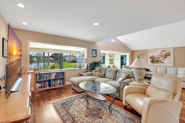 living room featuring lofted ceiling and light wood-type flooring