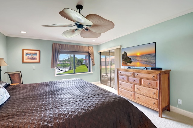 carpeted bedroom featuring ornamental molding and ceiling fan