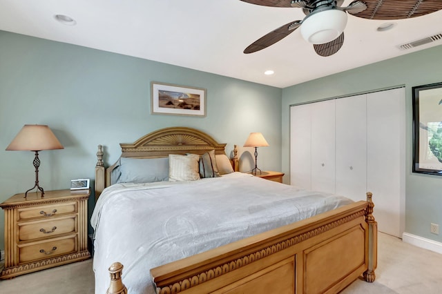 carpeted bedroom with a closet and ceiling fan