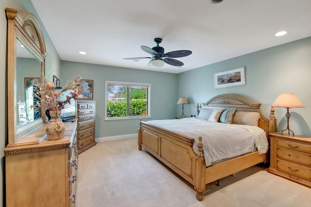 bedroom featuring light carpet and ceiling fan