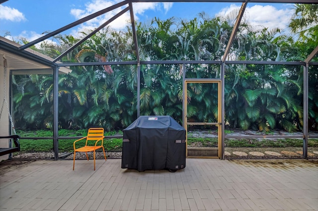 view of patio / terrace featuring a lanai and a grill