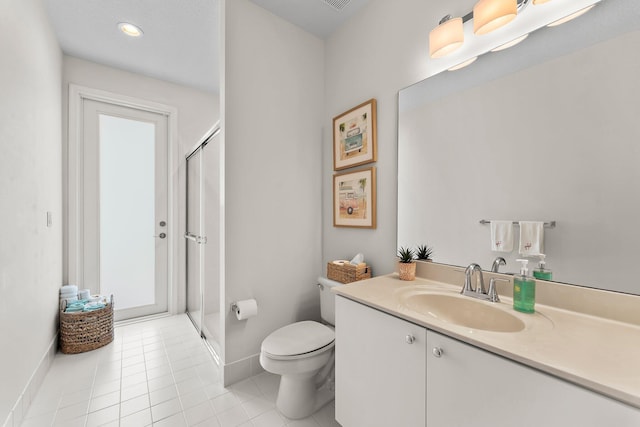 bathroom with a shower with door, vanity, toilet, and tile patterned flooring