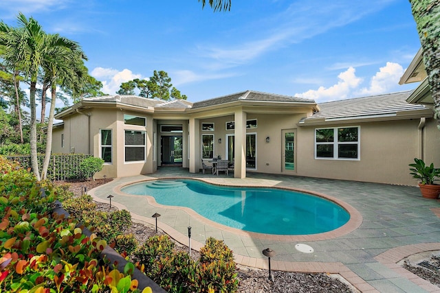 view of swimming pool featuring a patio