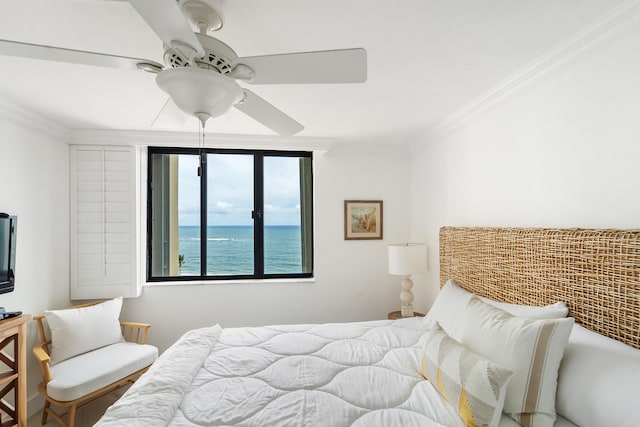 bedroom with crown molding, a water view, and ceiling fan