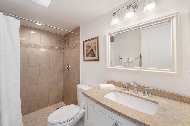 bathroom with vanity, toilet, and curtained shower