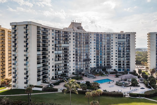 view of building exterior with a community pool