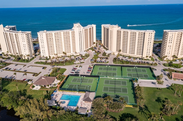 birds eye view of property with a water view