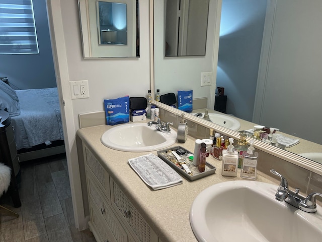 bathroom with vanity and wood-type flooring