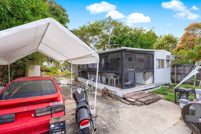 exterior space with a carport