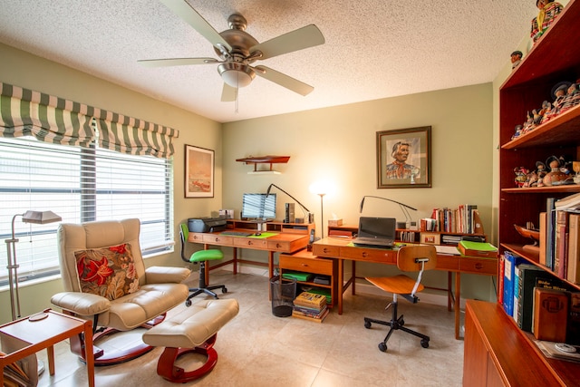 office space with a textured ceiling and ceiling fan